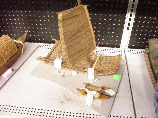 [2] Chinese Junk and Outrigger: [2] Vintage reed and burlap Chinese Junk rigged raft, together with a small-scale outrigger canoe, late 19th/ early c. 15 1/2"= length (junk); 5 1/2" = length (outrigger) Provenance: From the collecti