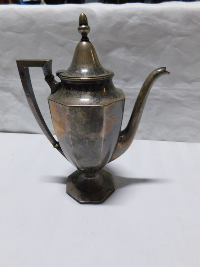 Sterling Coffee Pot: Sterling Coffee Pot, anchor / N maker's mark, #524, paneled Federal style with octagon base, 9"h, 6 3/4"l, 9.5 ozts. CONDITION: Very fine. Tarnished.