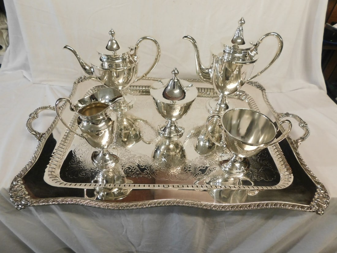 Sterling Silver Coffee Service: Sterling Silver Coffee Service by "F & F", five pieces, Federal style and model #1201; bone insulators, monogramed, includes: 10 1/2"h, coffee pot, 9" teapot, 7" creamer, 7 1/2" covered sugar bow and 