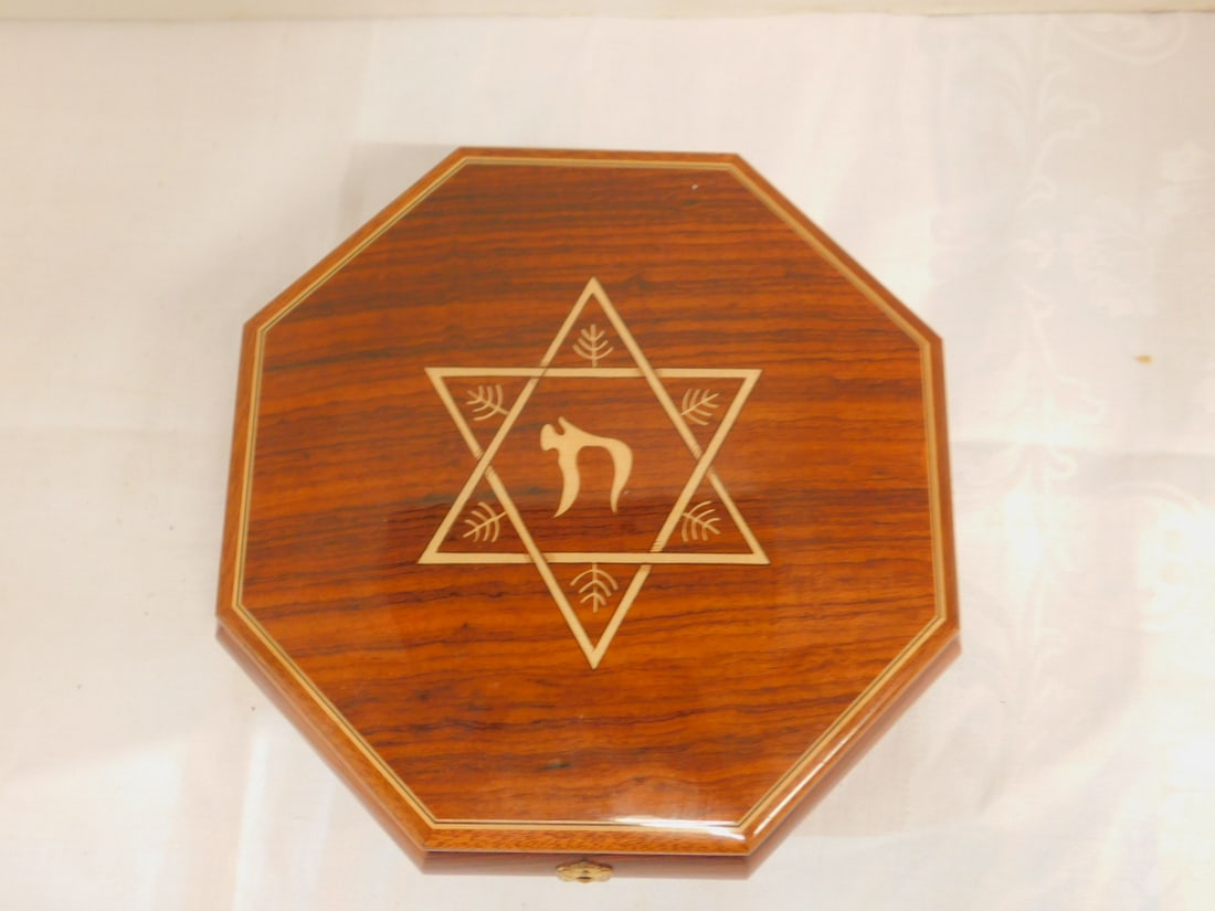 Judaica Music Jewel Box: Judaica Music Jewel Box by Reuge, Swiss, plays "Sunrise - Sunset", mahogany octagon box with inlaid Star of David, velour lined, brass feet, 8 3/4"d, 2 3/4"h. CONDITION: Very fine, working.