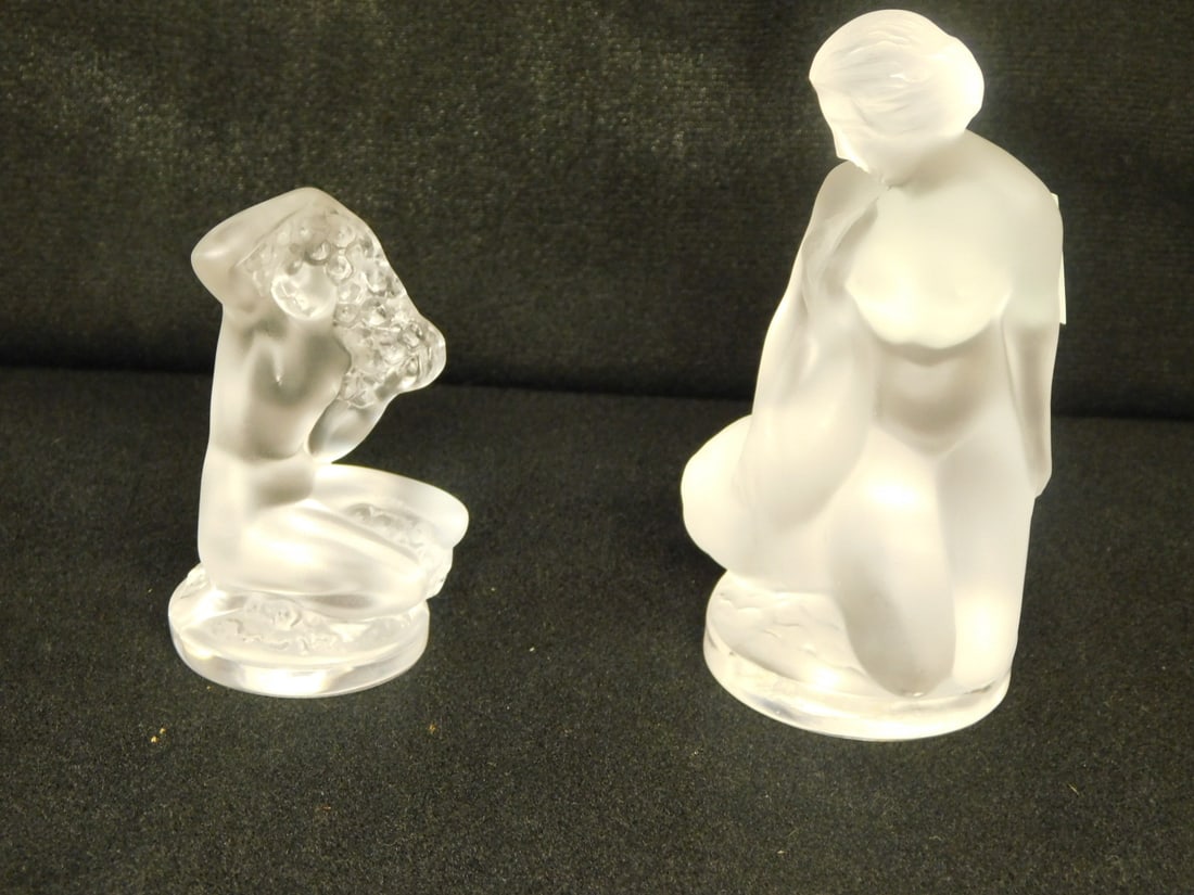2 Lalique Figures: Two Lalique Figures, includes: Fluer nude with box; plus Leda and the Swan (no box), both frosted glass and signed. CONDITION: Very fine. No issues identified.