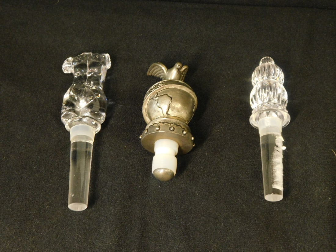 3 Bottle Stoppers: Three Bottle Stoppers, includes: Mikasa Australian clear glass "Female nude Torso" and "Monterey" stacked reeded balls bottle stoppers, approx. 5 1/2", plus a Neiman Marcus silver plate "Peace and Hop