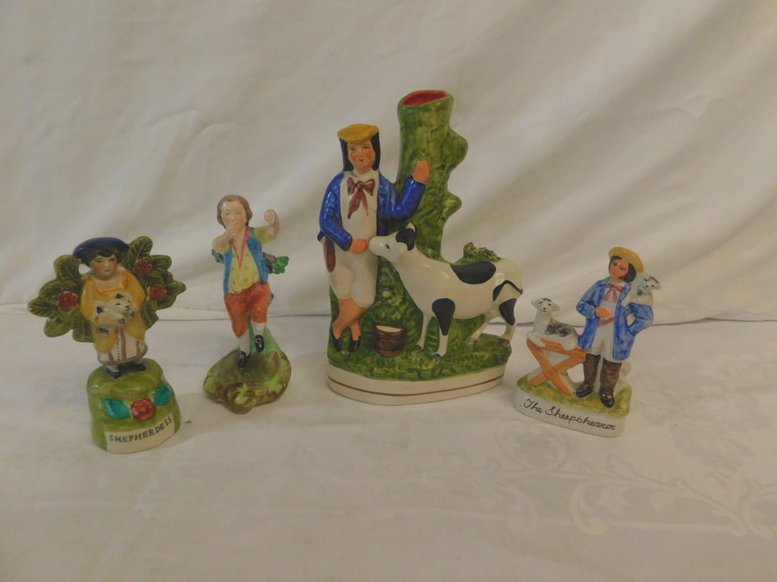 Staffordshire Figures: Staffordshire Figures, includes: boy with cow spill vase, 9" x 6"; shepherdess figure 5 3/4"; the shepherd 5 1/2" x 3" and Spode England china - triangles No. 13 figure 6 1/2", mid to late 20th C. CON