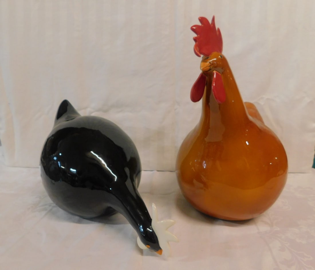 2 Longchamp Chickens: Two Longchamp Chickens, French faience porcelain by Catherine Hinter, includes: black feeding chicken 15" x 8 1/2", and an orange upright chicken 14 1/2" x 14", 20th C. CONDITION: Very fine.