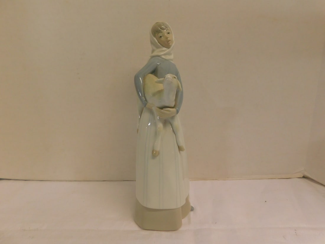 Lladro Figure: Lladro Figure, girl with lamb,porcelain, 10 5/8"h. CONDITION: Very fine. No issues identified.