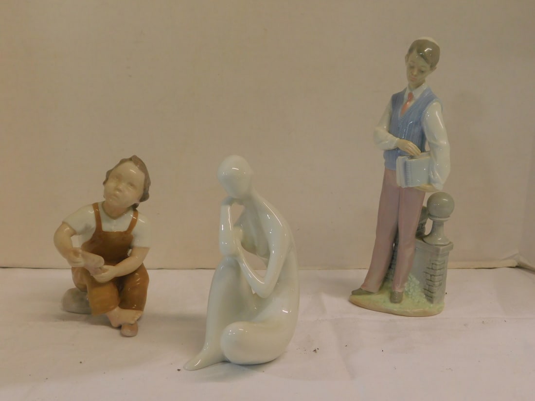 3 Porcelain Figures: Three Porcelain Figures, includes: Royal Dux Blanc de Chin seated female nude with paper lable,5 7/8"h; Bing & Grondahl #2275, seated boy with shoe 5 1/2"h, and Lladro No. 6029 standing boy with praye