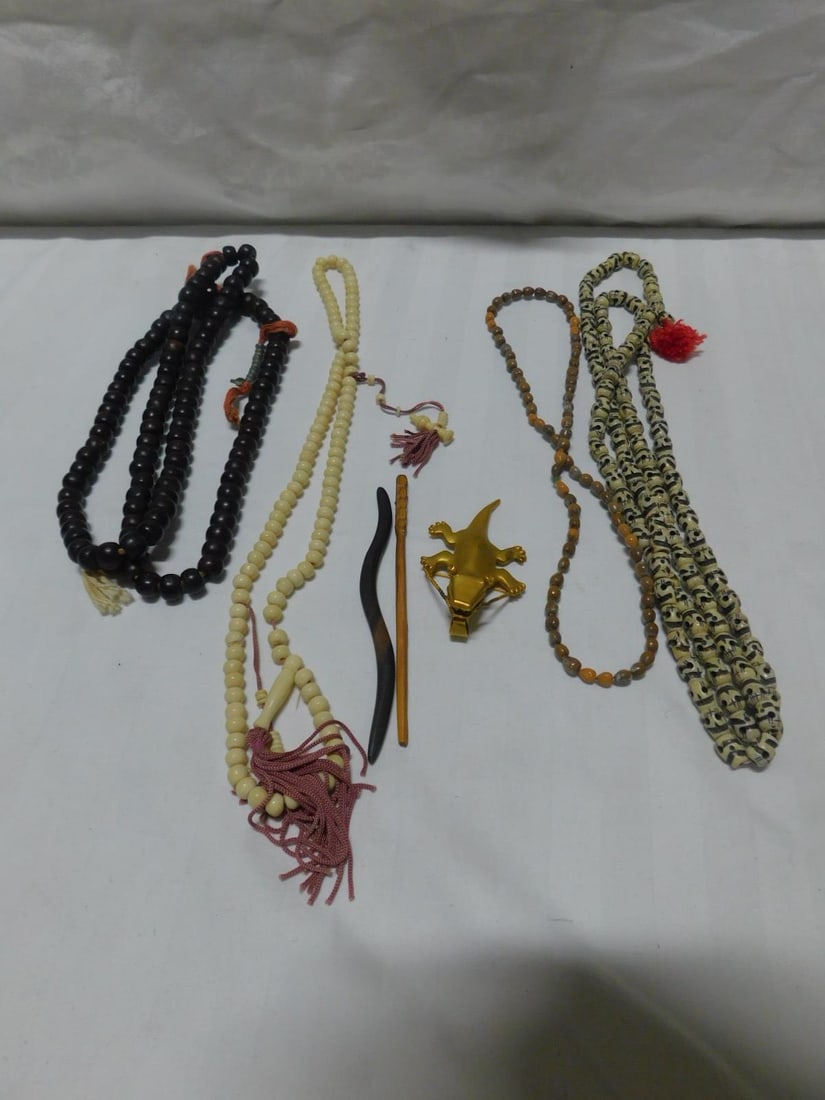 Oriental Prayer Beads: Oriental Prayer Beads, four different beads in bone, skull form and plane,wood and seed, plus a gold plated crocodile pen 3 3/8"l. CONDITION: Very good, used.