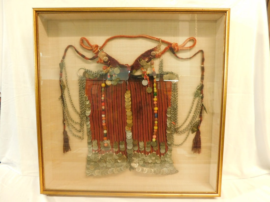 Egyptian Bedouin Nijab Veil: Egyptian Bedouin Nijab Veil Nomulu Married Woman's Veil, the quantity of coins indicates social status, pride and beauty; embroidered coral colored cloth with stripes, beads and chains, approx 17" x 1
