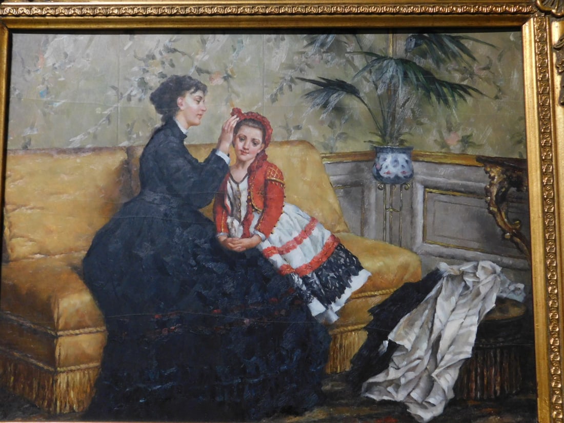 Genre Painting: Genre Painting, unsigned, oil on board, mother on sofa adjusting a young girls hat, image 12" x 15 1/2", carved and gilt frame 15 1/2" x 19 1/2", late 20th C. CONDITION: Line cracks across painting.