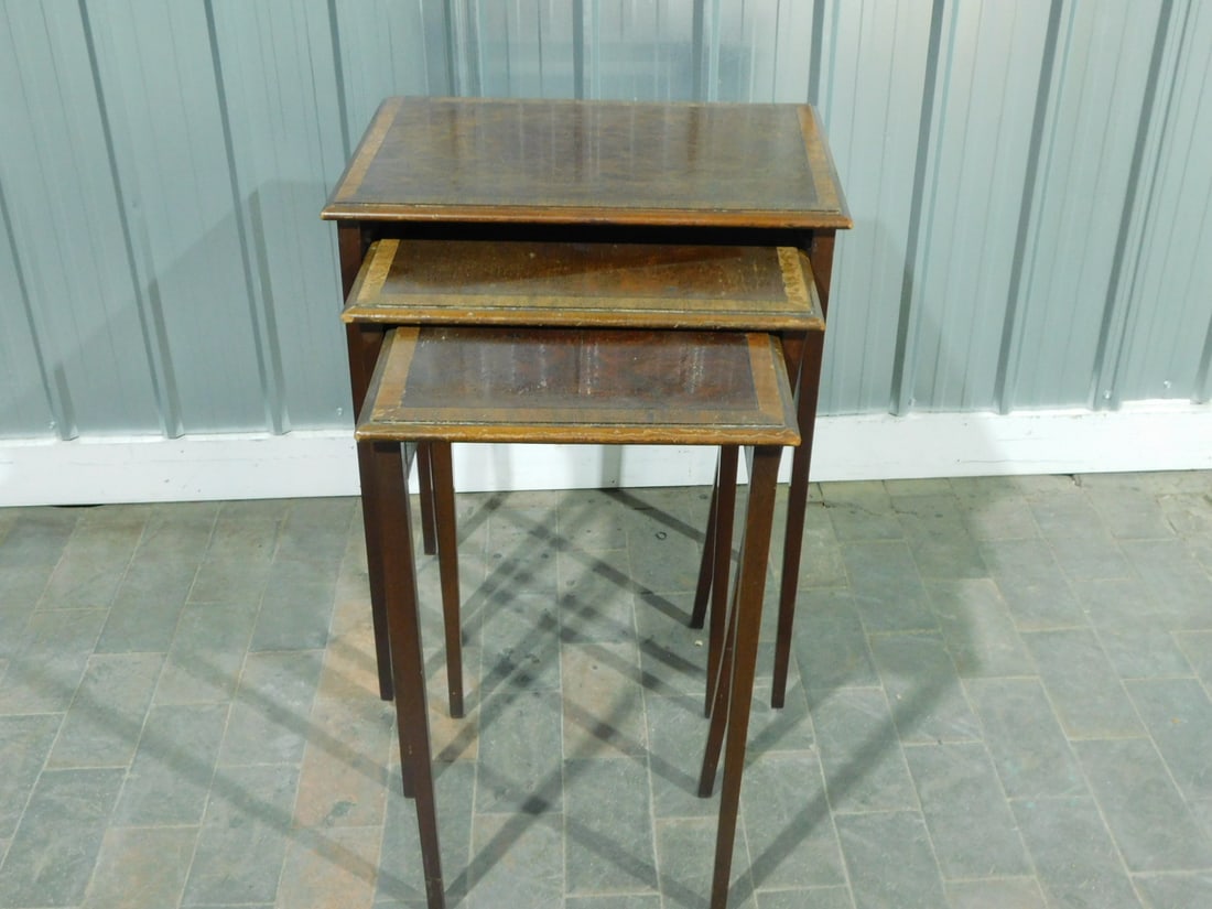 Nest of Tables: Nest of Tables, Federal style,banded mahogany, tapered square legs, circa 1940s, 20" x 14" x 26". CONDITION: Areas of wear and scratches.