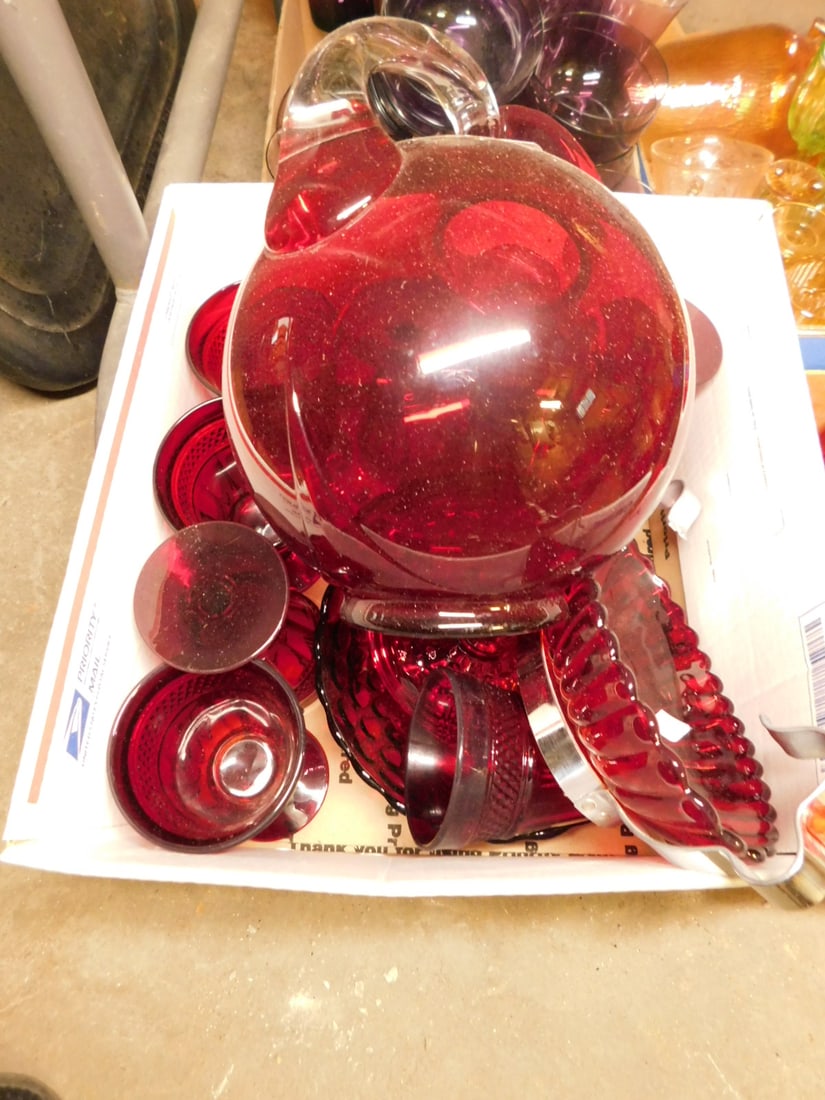 Ruby glass lot: Ruby glass lot, deco pitcher, clear handle (8) molded goblets, handled tidbit. Condition: good