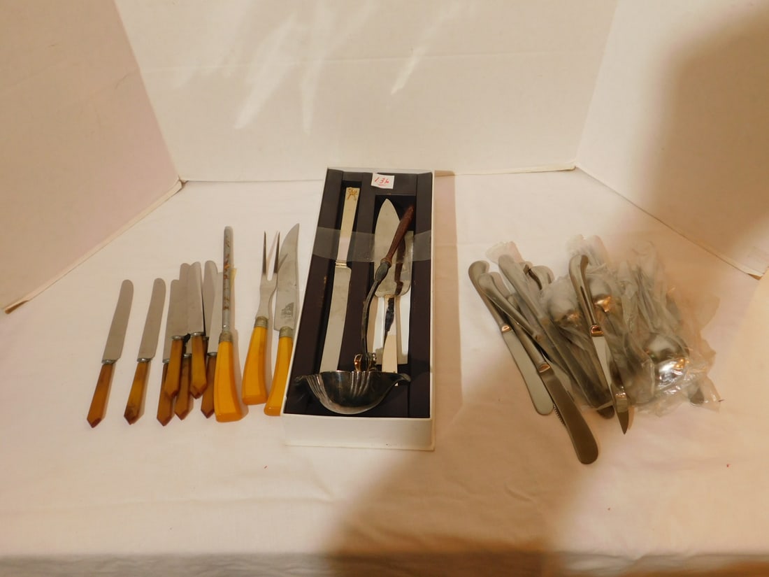 Flatware Group: Flatware Group, includes: silver plate wood handle 14" ladle, eight Bakelite , 8 3/4" and three piece set; two Vera Wang box cake servers, no lid, and a partial stainless steel flatware set, four stea