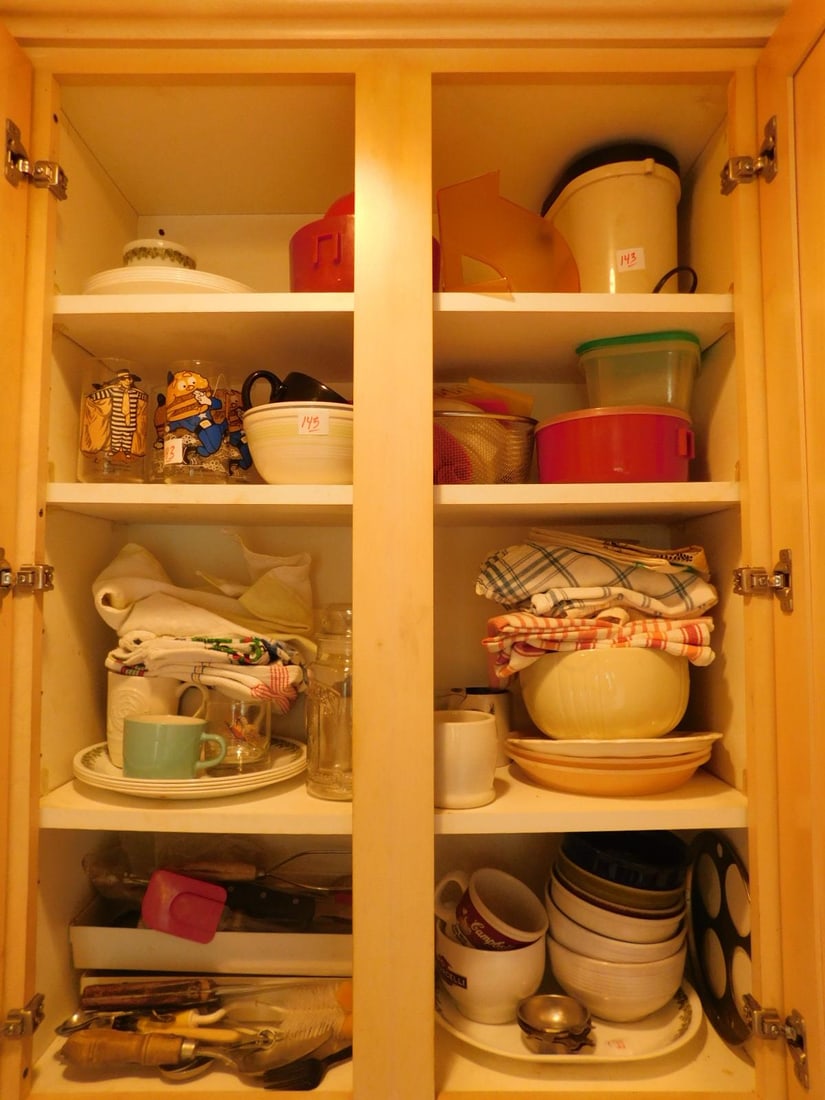 Assorted Kitchenware: Assorted Kitchen Wares, includes: cooking utensils, mixing bowls, cereal bowls, Corelle dishes, mugs, four McDonald land tumblers. CONDITION: Good, used.