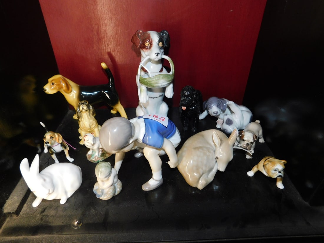 Dog & Child Figures: Dog and Child Figures, eleven pieces, mostly porcelain, includes: B & G boy shooting marbles, 4 1/2"l; 2" Copenhagen sea nymph; and rabbit, 6"DC souvenir dog with basket, Copenhagen, Stafford shire, G