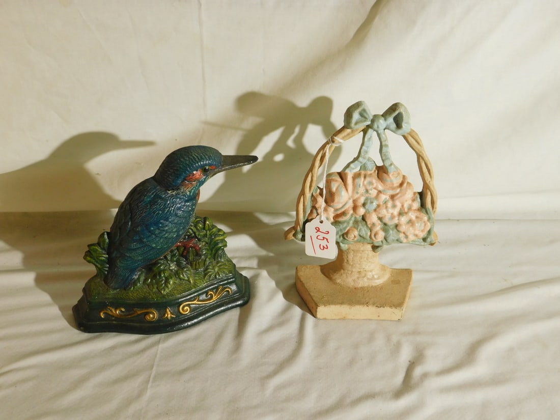 2 Cast Iron Door Stops: Two Cast Iron Door Stops, includes: Vintage 8"h, floral basket, early 20th C, and a 6 1/2"h wood pecker by Wright Studios, late 20th C. CONDITION: Very good.