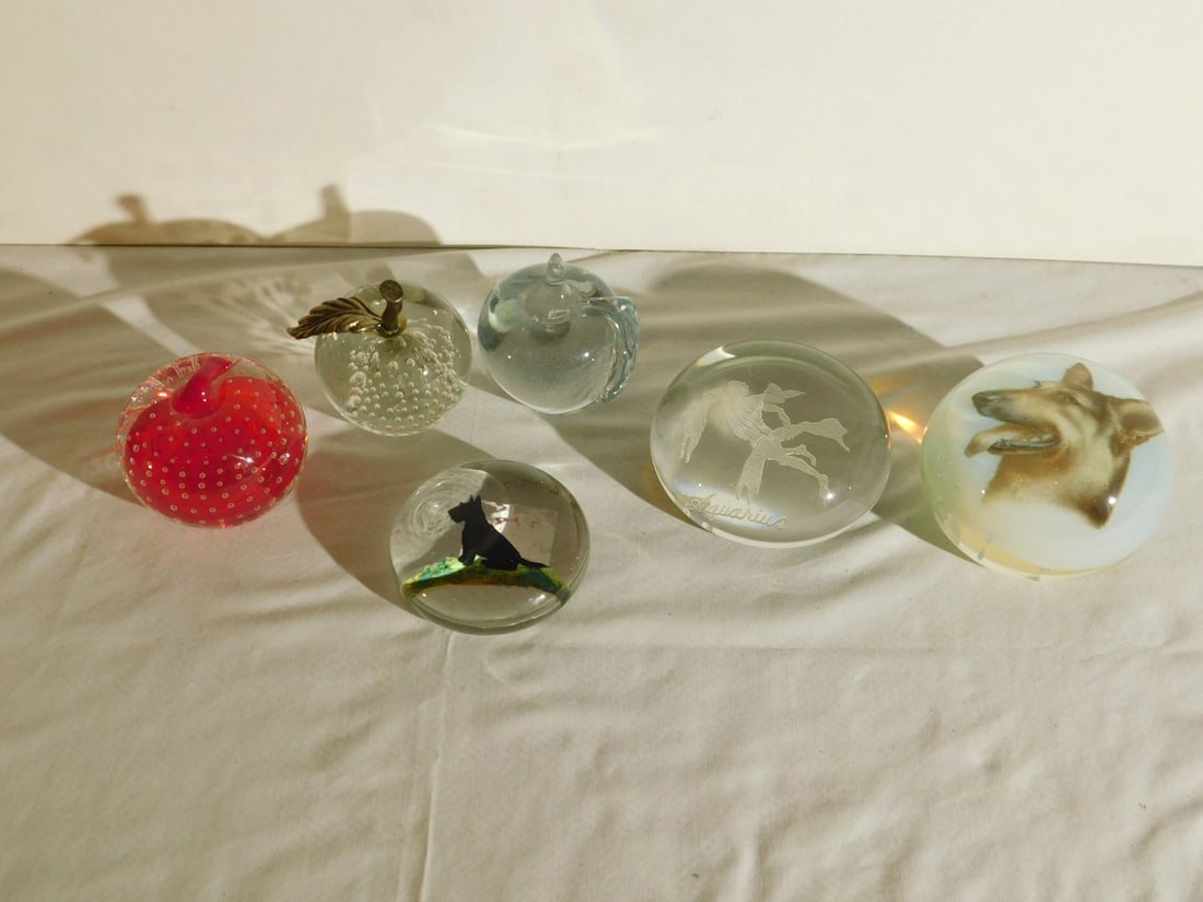 6 Paperweights: Six Paperweights, includes: reverse painted Scotty Dog; opalescent and clear German shepherd; etched glass "Aquarius"; cranberry bubble glass apple; brass stem and clear bubble glass apple and a clear