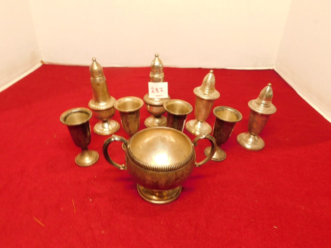 Sterling Silver Tableware: Sterling Silver Tableware, all weighted, includes: four 3" cordials, sugar bowl, and two pair salt and pepper shakers. CONDITION: Tarnished.