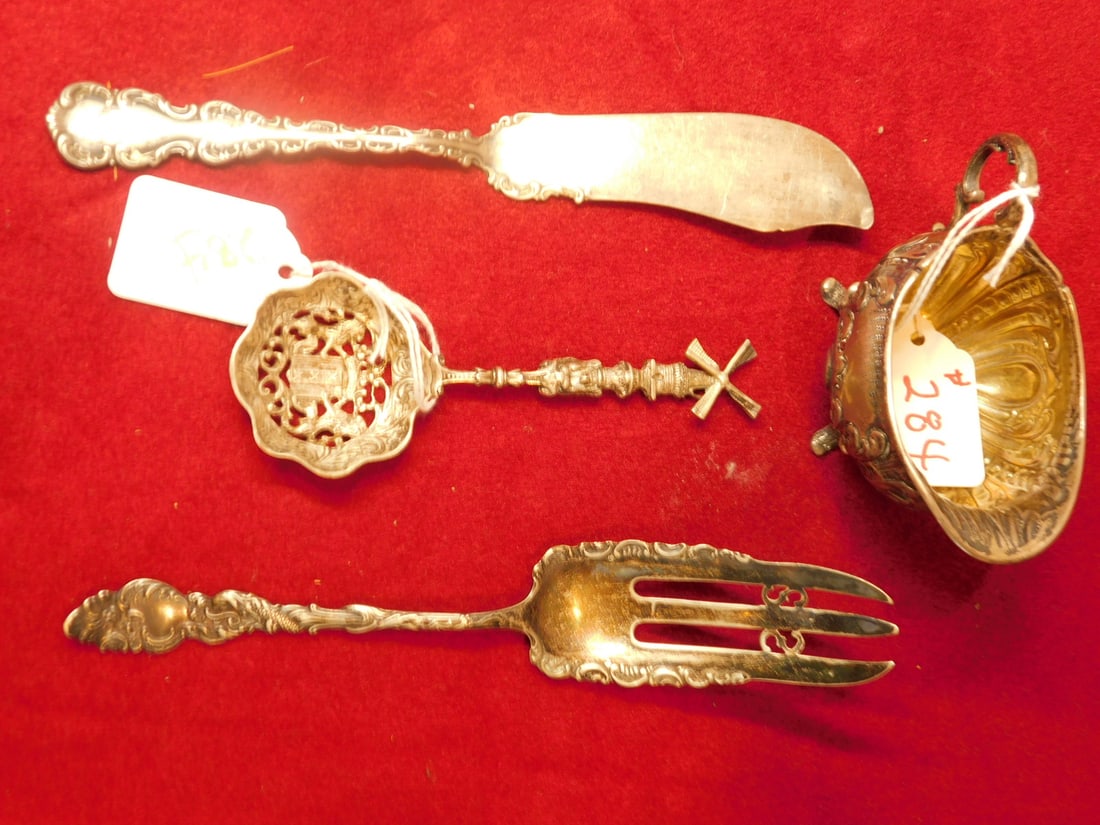 Silver Creamer & Utensils: Silver Creamer and Utensils, includes: Birmingham - England acanthus scroll repousse footed creamer 4"l; an 800 silver continental touch marked lion and windmill cast soon 5"l; a 7 1/2" serving fork a