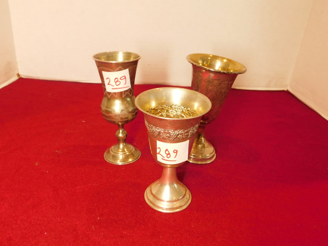 3 Silver Kiddush Cups: Three Silver Kiddush Cups, includes: 5" sterling with etched Morgan David, 5 1/4" Russian '84 touch mark with etched buildings and flowers, and an 800 silver with grape embossed bands, 6.54 ozts TW. C