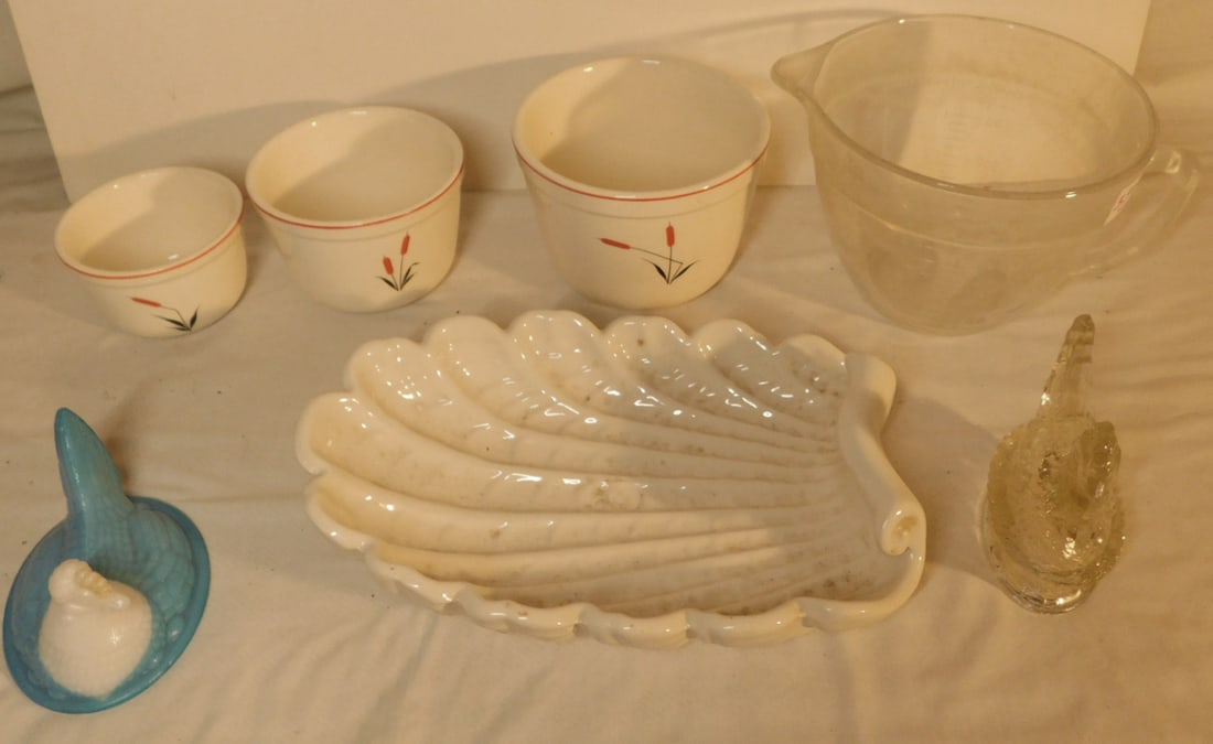 Assorted Group: Assorted Group, includes: Abingdon pottery shell bowl 12"l, cam wood ivory nest of three mixing bowls, Fire King two quart measuring cup (small rim flake), molded glass hen on basket 5"l, and a milk a
