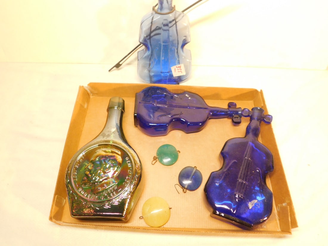 4 Bottles: Four Bottles, includes: three violin shape blue and green 8" and 9 1/2" and Robert E. Lee iridescent glass 8 1/2" bottle. CONDITION: Very good.