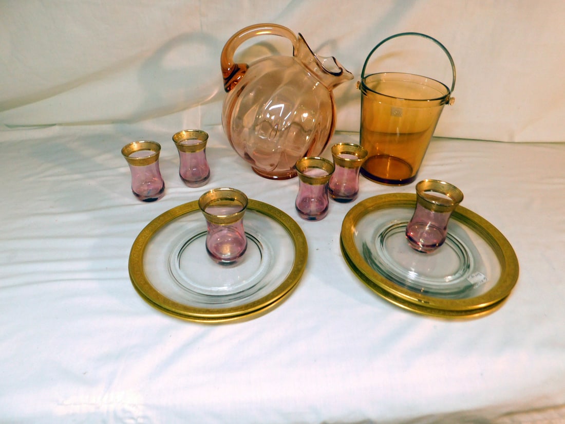 Depression Glass Group: Depression Glass Group, includes: Cambridge pink tilt ribbed pitcher 8 3/4"h, 6"h pink ice bucket with brass handle, six pink wedding band 3 1/4' cordials, and five 8"d clear wedding band plates. COND