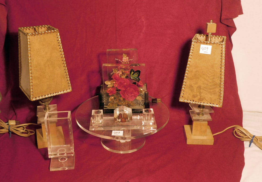 Lucite Group: Lucite Group, includes: a pair of Lucite and wood lamps with dried fern paper and vinyl woven shades, 15 1/2"h, one lamp missing finial; Lucite 12"d cake stand; Rose interior Lucite plaque on light me