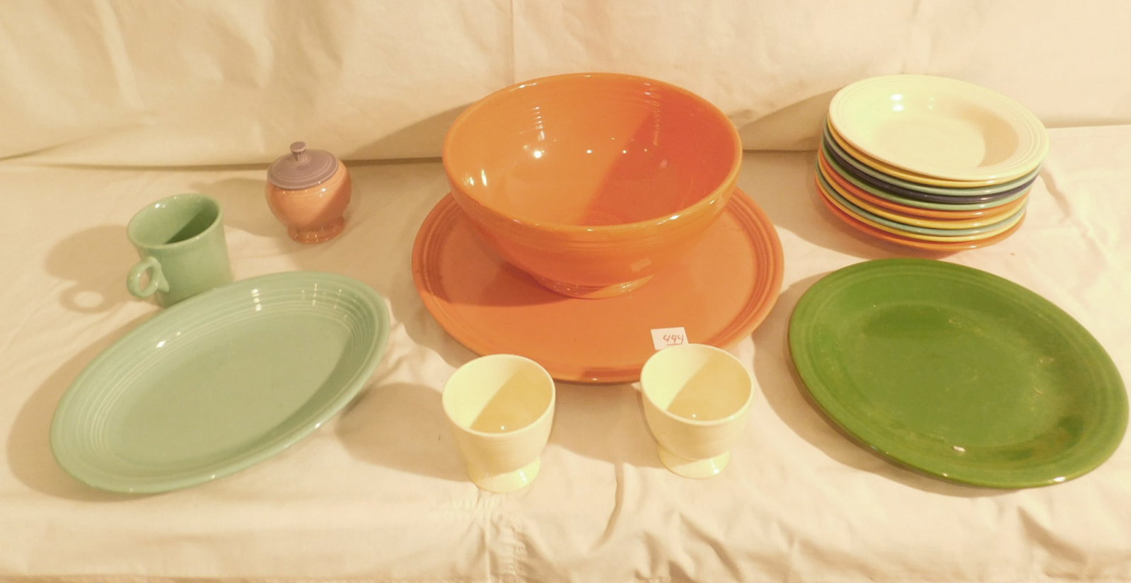 Fiesta China Group: Fiesta China Group multiple colors, includes: 11"d, tray, 11 1/2"L oval platter 10 wide rim soups, 10 1/2" plate, covered sugar, mug, 2 cups. CONDITION: Very good