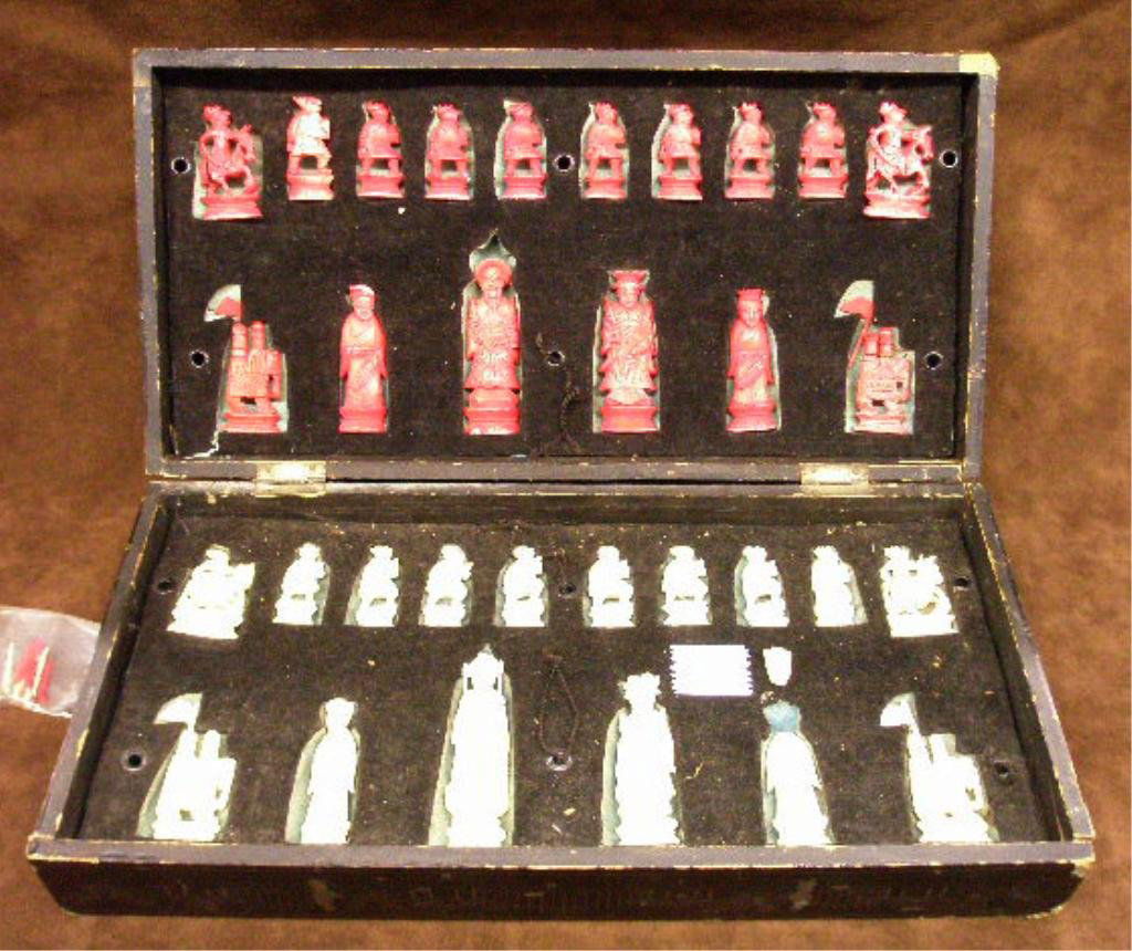 Chinese Ivory Chess Set: Chinese Ivory Chess Set, in red dye natural, from 1 3/4" to 3 3/4", enclosed black lacquered fitted box, early 20th c. includes small bag of attachments. NO INTERNATIONAL OR CALIFORNIA SHIPPING. CONDI