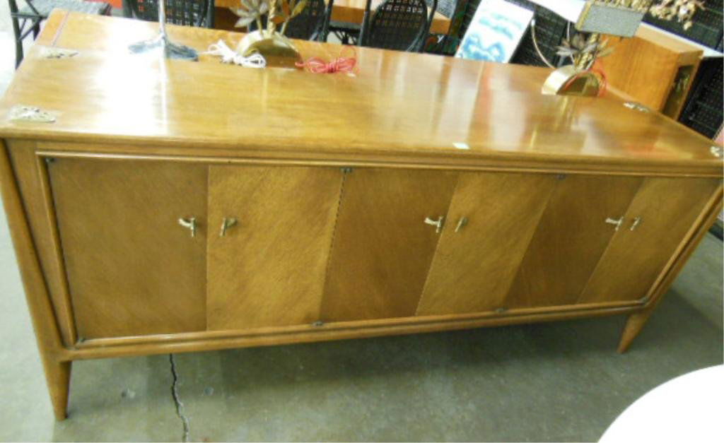 Modern Style Credenza: Modern Style credenza, "Facade by Mount Airy" walnut with brass butterfly top corner mounts, length 72', circa 1960. CONDITION: Scratches to top.