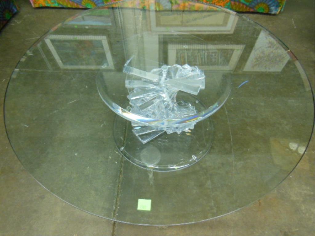 Lucite & Glass Cocktail Table: Lucite & glass cocktail table with spiral steeped column; diameter 42", circa 1960. CONDITION: No issues identified.