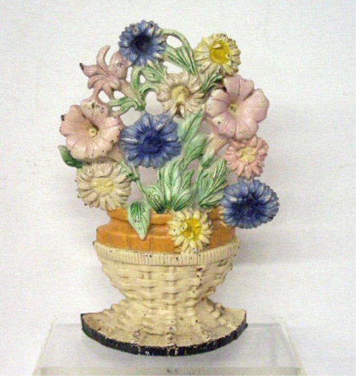 Hubley Cast Iron Petunias and Asters Doorstop: Hubley Mfg. Co. painted cast iron #470 Petunias and Asters 9 1/2" x 6 1/2 doorstop. CONDITION: Areas with paint loss & rust.