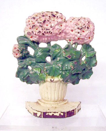 Hubley Cast Iron Primrose Doorstop: Hubley Mfg. Co. painted cast iron #488 Primrose 7 1/2" x 6 1/8" doorstop. CONDITION: Areas with paint loss & rust.