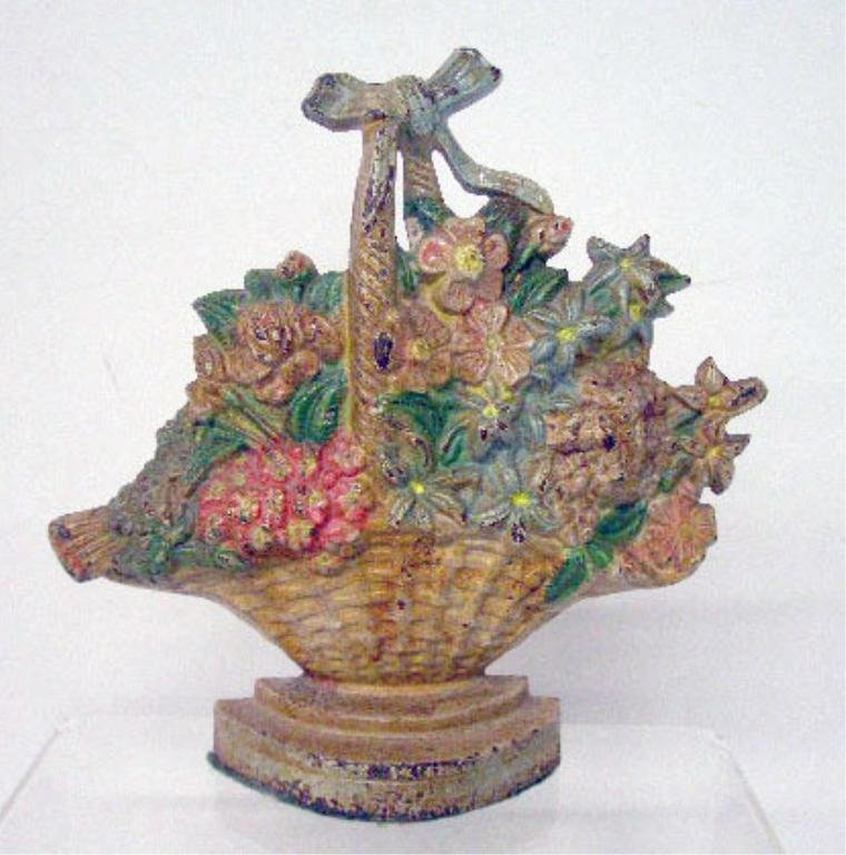 Hubley Cast Iron Wild Roses Doorstop: Hubley Mfg. Co. painted cast iron #475 Wild Roses 7 1/2" x 7 1/2" doorstop. CONDITION: Areas with paint loss and rust.