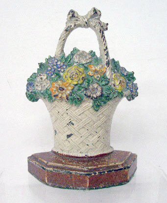 National Foundry Flower Basket Doorstop: National Foundry painted cast iron #42 Flower Basket 7 1/4" x 4 3/4" doorstop. CONDITION: Areas with wear, paint loss and rust.