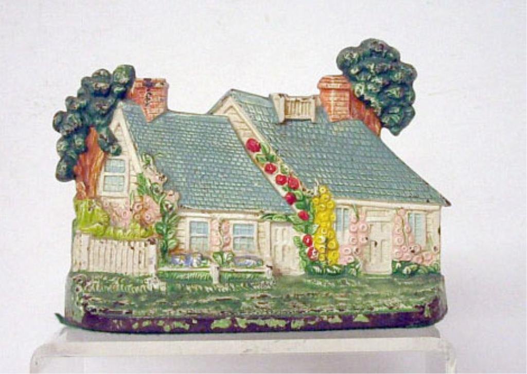 Hubley Cast Iron Cottage Doorstop: Hubley Mfg. Co. painted cast iron Cottage 5 5/8" x 8 1/8" doorstop. CONDITION: Areas with paint loss and rust.