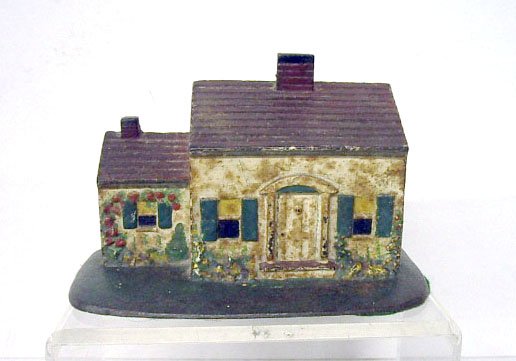Gray Iron Casting Co. Cottage Doorstop: Gray Iron Casting Co. painted cast iron Cottage 4 3/4" x 7 3/8" doorstop. CONDITION: Areas with wear, paint loss and rust.