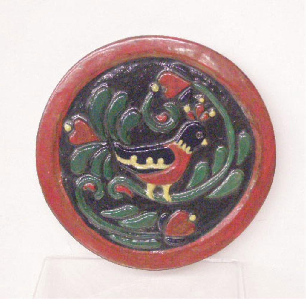 Contemporary Painted Redware Wall Plaque: Unsigned contemporary Pennsylvania Dutch style painted redware 9 1/4" wall plaque. CONDITION: Small chip on backside rim.