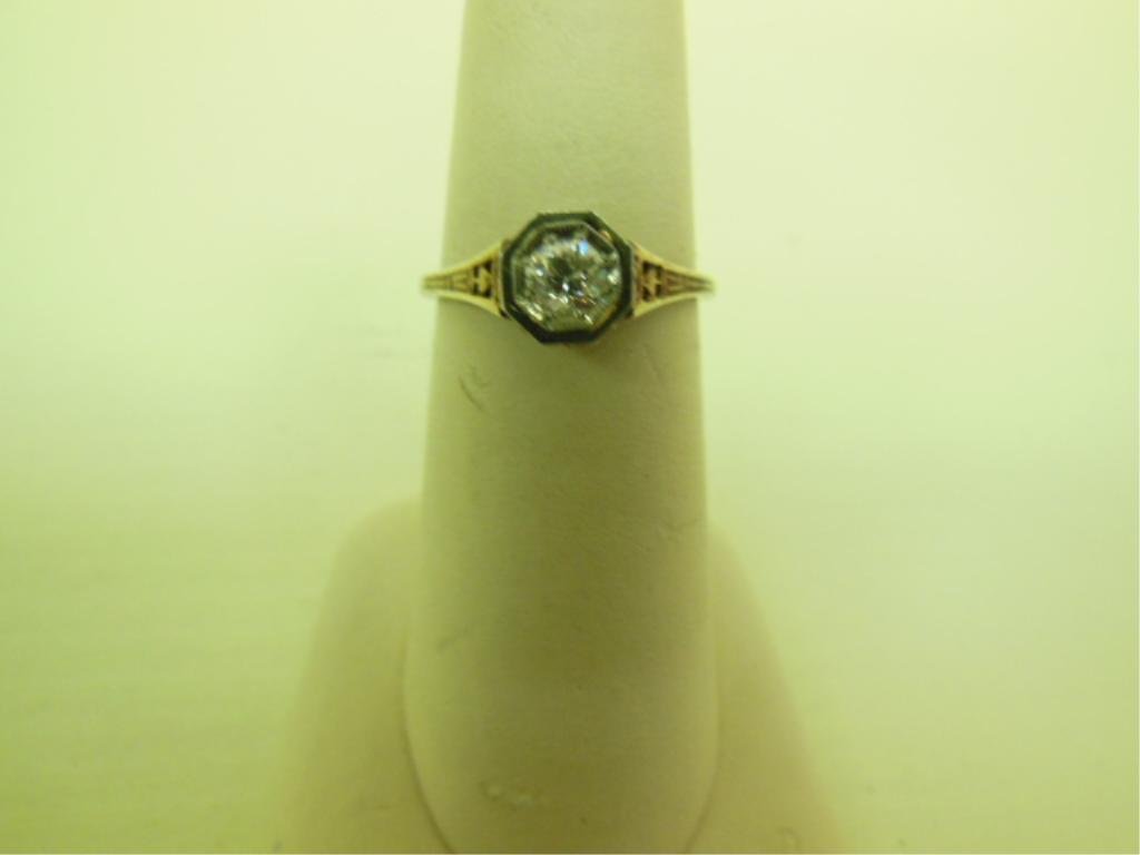 14k & Diamond Art Deco Engagement Ring: Art Deco engagement ring, 14k yellow gold filigree high setting with white gold bezel holding an approximate 50 pt European cut round diamond of good color and clarity, 1.4 DWT, size 6 1/2. Condition: