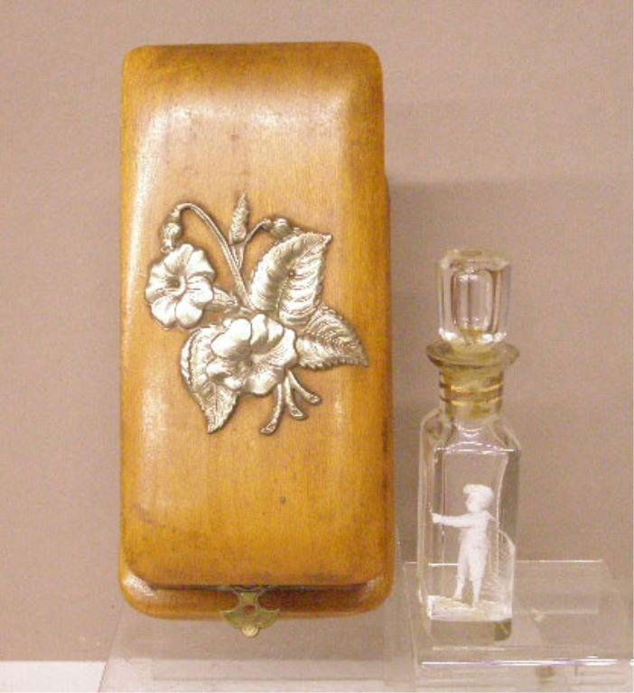 19th c. Mary Gregory Glass Cologne Bottle: 19th c. Mary Gregory glass 5 1/4" cologne bottle with original soft wood fitted case. CONDITION: Bottle has stuck stopper and cologne residue, case is very good with loss of bottom cover paper.
