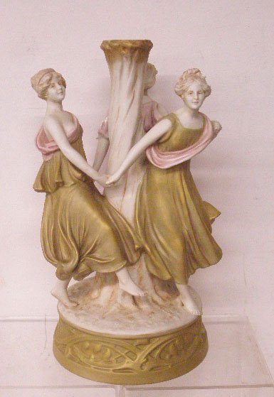 Royal Dux Porcelain Figural Compote Base: Antique Royal Dux porcelain 17" x 9 3/4" Dancing Maidens compote base. CONDITION: 1 maiden has crack through neck & hair, damage on dress of 1 maiden.