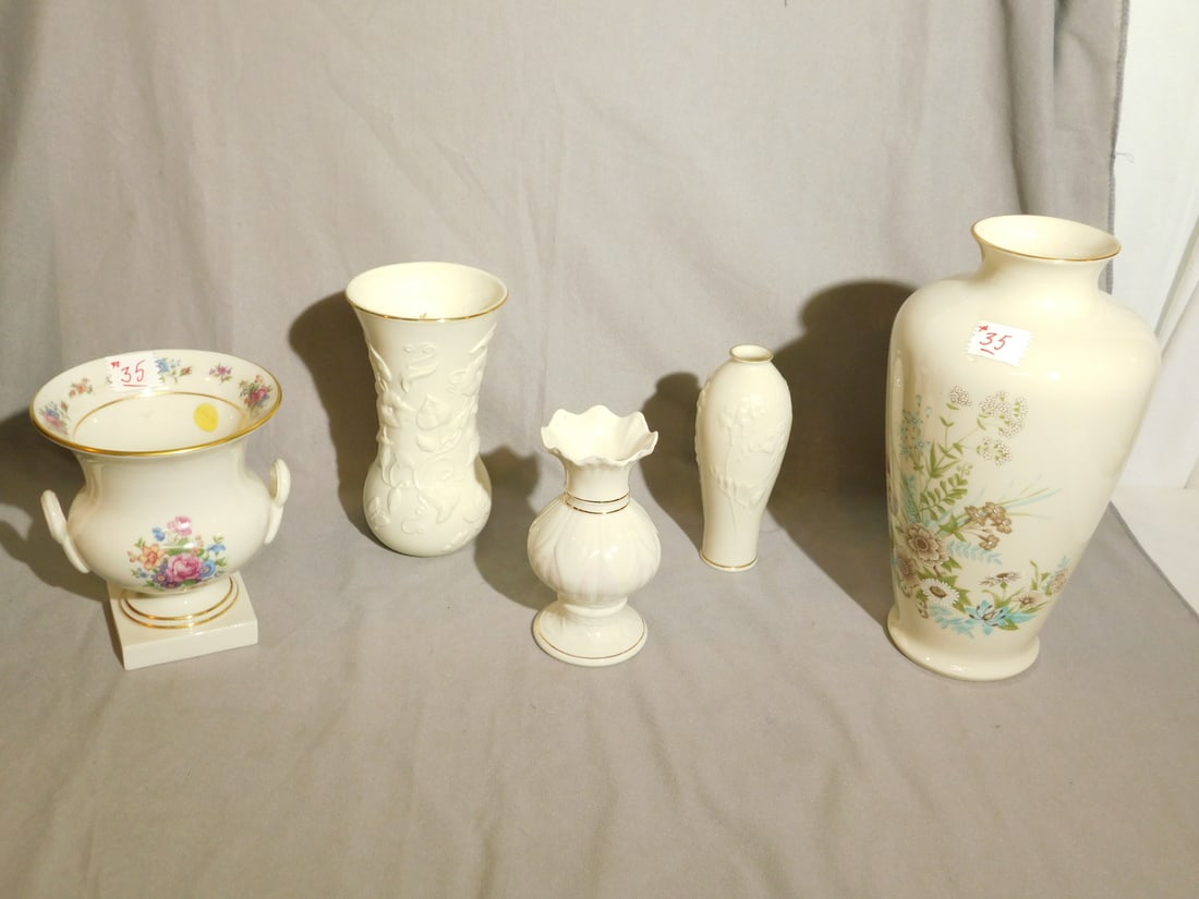 5 Lenox Vases: Five Lenox Vases, includes: floral painted 6 3/4"h urn with early green mark, floral decorated 12" vase, "Floral Meadow" molded 8" vase, plus 6 1/2" and 7" vases. CONDITION: Very good.