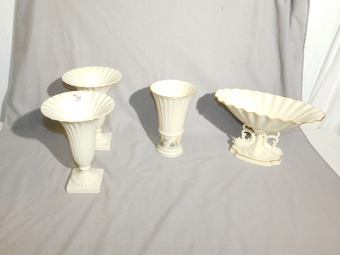 4 Lenox Pieces: Four Lenox Pieces, includes: Aquarius center piece, 12" x 7" x 6 1/4", leaf bordered 8" vase and a pair of 8 3/4" trumpet form urns with early green marks. CONDITION: Very fine.