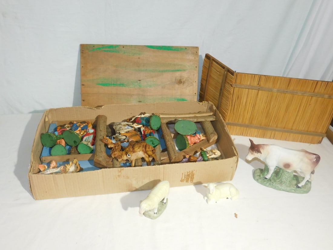 Italian Composition Nativity Set: Italian Composition Nativity, including: wood creche with hand painted background, Mary, Joseph and Jesus, three wise men, shepherd, one camel and various bar animals, plus angel. CONDITION: One wise 