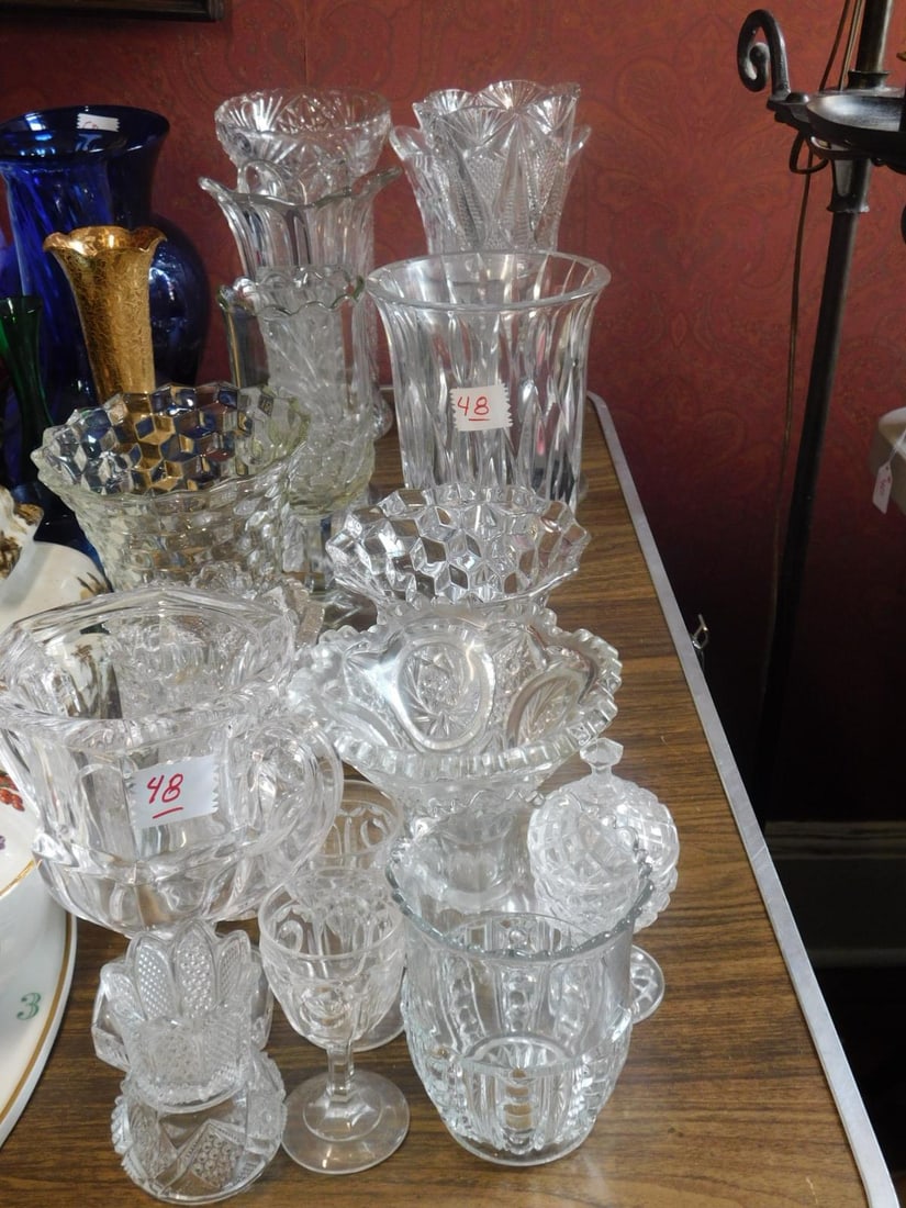 Pattern Glass Group: Pattern Glass Group, eighteen pieces includes: vases, spooners, celery tooth pick, condiment, etc. from 3 1/2" to 12". CONDITION: Very good.