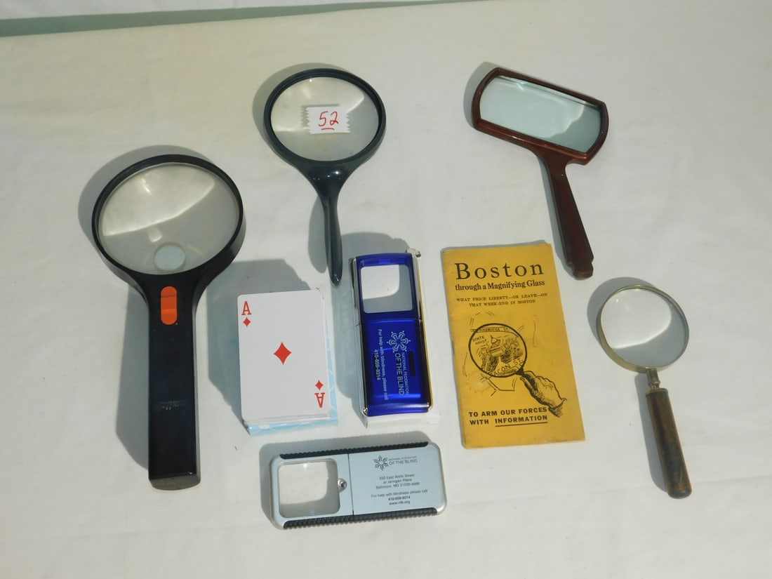 Magnifying Glasses: Magnifying Glasses, seven assorted plastic and metal framed magnifying glasses, one with light plus pamphlet. CONDITION: Good, used.