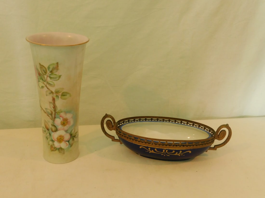 Porcelain Bowl & Vase: Porcelain Bowl and Vase, JBH, check bowl inset in floral metal double handled frame, floral accent decoration, 10"l, plus alba - bunst, Alboth and Kaiser floral decorated vase, 9 1/2"h. CONDITION: Goo