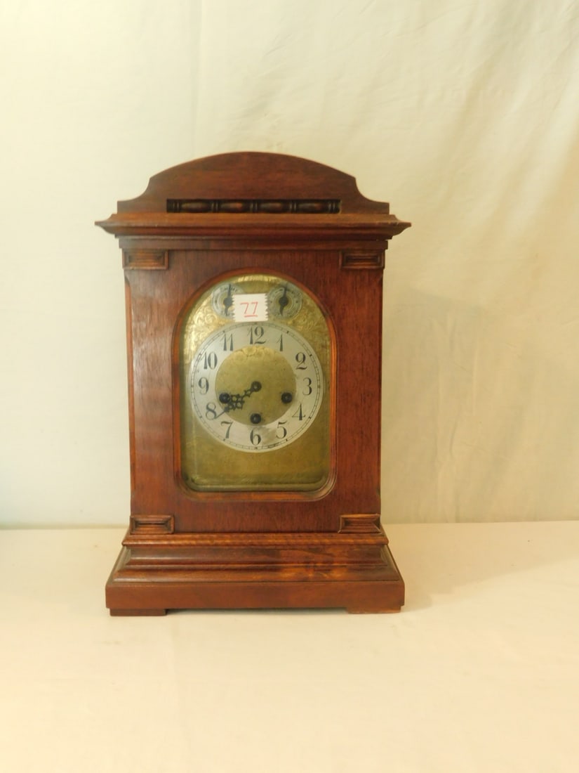 Junghans Clock: Junghans Clock, large mantle style, #210, time, strike and chime movement, mahogany case, beveled glass front panel, 11 1/4" x 8" x 17 1/2". CONDITION: Good, minor wood wear, working condition unknown