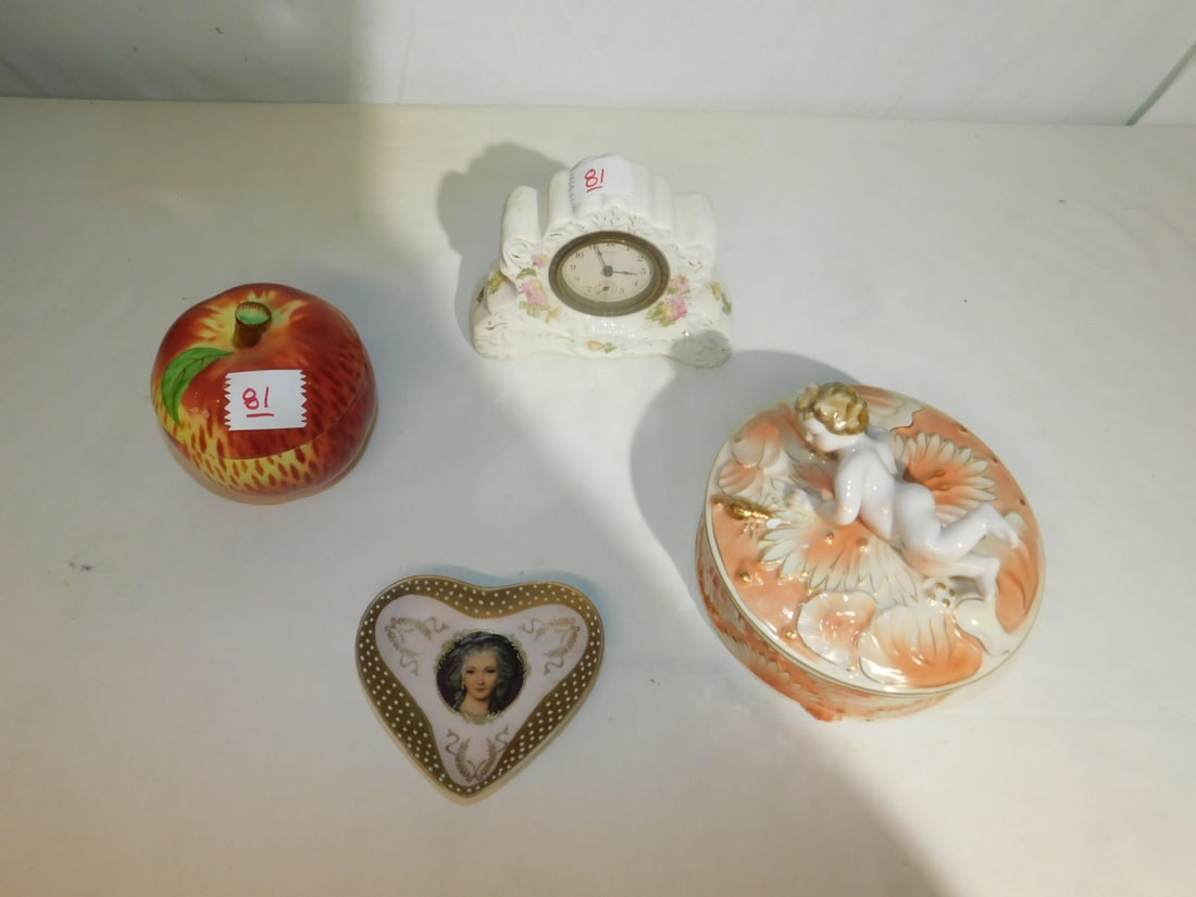 Assorted Porcelain: Assorted Porcelain, including: New Haven porcelain floral clock putti topped round 6" lidded box, apple form 4" box, porcelain heart dish with female portrait and figural front small planter. CONDITIO