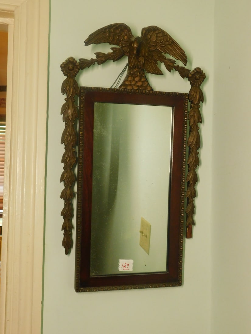 Neo Classical Wall Mirror: Neo Classical Wall Mirror, mahogany with gessoed and gilt eagle crest and pediment garlands, mid to late 19th C, 24" x 13". CONDITION: Some spotting on mirror, loss to back of right side garland.